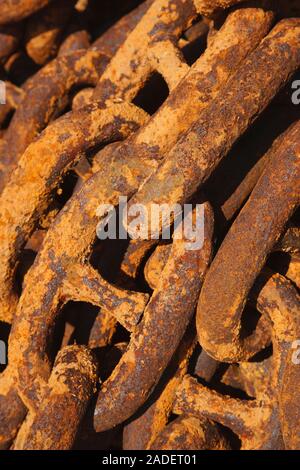 Rusty chain on quayside. Stock Photo