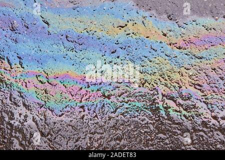 Oil spill on asphalt road background or texture Stock Photo