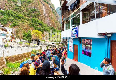 MACHU-PICCHU-PUEBLO, PERU - JUNE 7, 2019: People walk in the tourist village Stock Photo