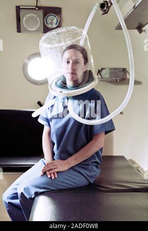 MODEL RELEASED. Hyperbaric oxygen therapy. Medical workers training in the use of hyperbaric oxygen therapy, a treatment that can be used for a range Stock Photo