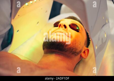 Bearded man smiling in the modern solarium Stock Photo