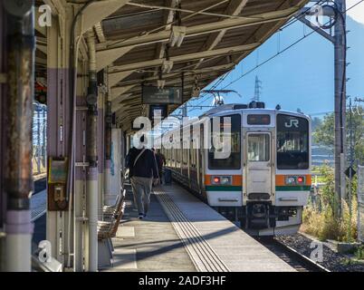 Nagoya, Japan - Nov 10, 2019. A local train coming to JR Station in Nagoya, Japan. Trains are a very convenient way for visitors to travel around Japa Stock Photo