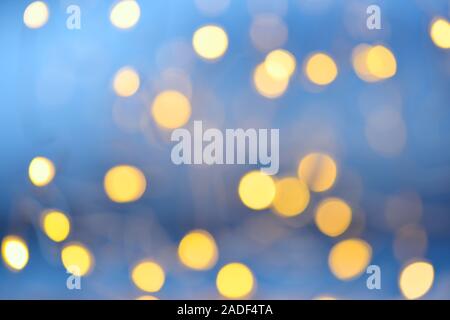 Orange, golden and blue Blurred lights background. Defocused glitter  background. New year or Christmas background Stock Photo - Alamy