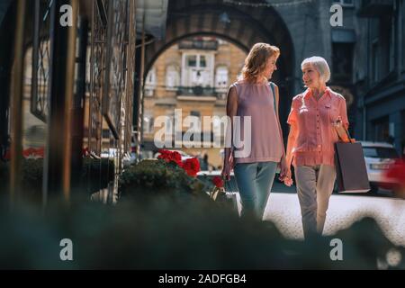 Two women talking while walking stock photo Stock Photo