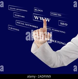 Businessman pressing business type of modern buttons with virtual background Stock Photo