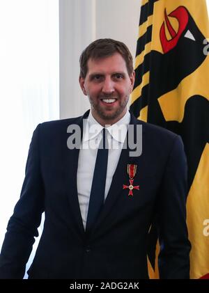 Berlin, Germany. 4th Dec, 2019. Former German basketball player Dirk Nowitzki reacts after being awarded the Order of Merit of the Federal Republic of Germany at the Bellevue Palace in Berlin, capital of Germany, on Dec. 4, 2019. Credit: Shan Yuqi/Xinhua/Alamy Live News Stock Photo