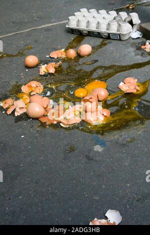 A Dozen Broken Eggs on a Sidewalk, USA Stock Photo