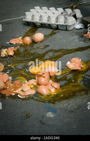 A Dozen Broken Eggs on a Sidewalk, USA Stock Photo