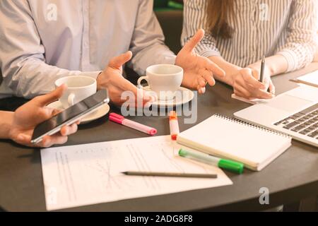 Partners discussing new business strategy with graphs Stock Photo