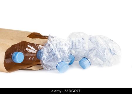 Empty plastic bottles in a brown paper bag Stock Photo