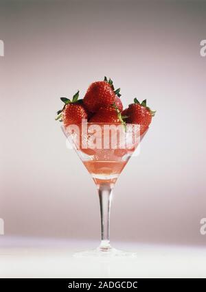 A glass containing ripe strawberries. Stock Photo