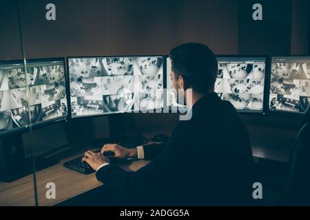 Profile side view portrait of his he nice serious professional man qualified expert safeguard supervising customers online safety remote panel night Stock Photo