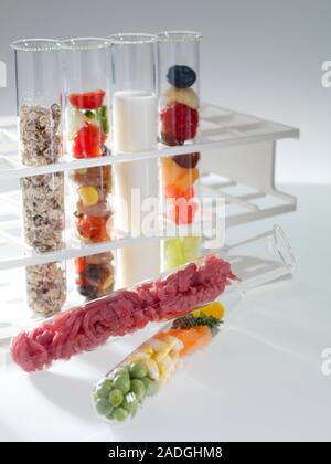 Balanced diet. Test tubes containing the components of a healthy diet. In the rack are (from left to right): cereals, salad, milk and fruit. Lying on Stock Photo