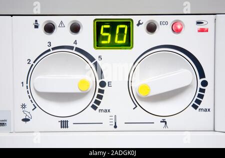 Domestic boiler. Control panel for gas-fired condensing boiler for central heating and hot water. These controls are set for maximum economy. Stock Photo