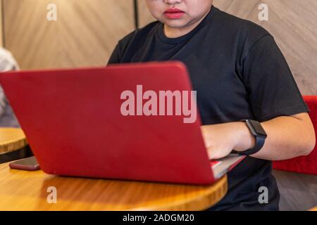 Close up photo of freelancer using laptop at co-working space Stock Photo
