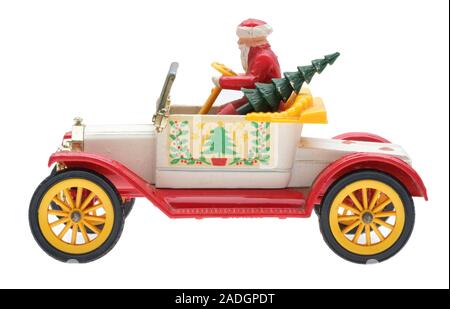 Father Christmas in an old Ford motor car. Dinky die cast metal toy with Santa and a Christmas tree. Stock Photo