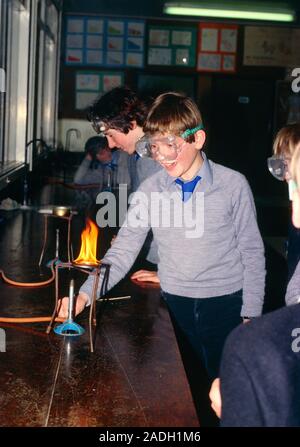 Pupils heating iron filing in practical chemistry class. Stock Photo