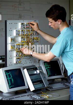 Electronics trainee carrying out an exercise during a vocational training course. Photographed in Germany. Stock Photo
