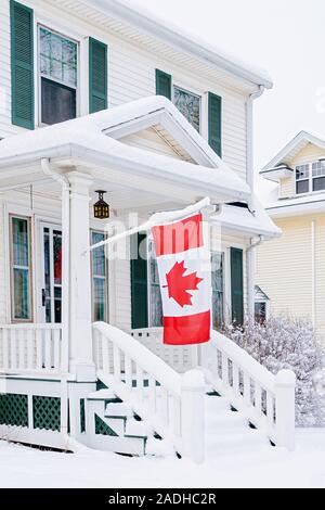 Traditional older family home covered in snow. Stock Photo