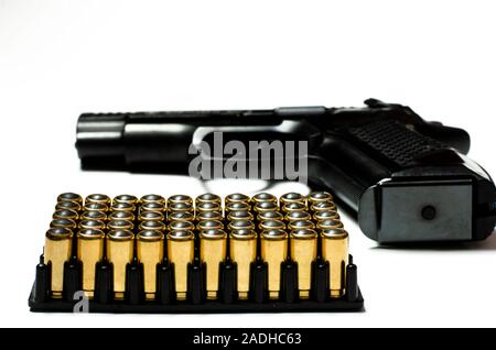 Patrons for a traumatic pistol stand in a black plastic form for cartridges. Weapons Stock Photo