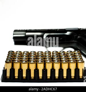 Patrons for a traumatic pistol stand in a black plastic form for cartridges. Weapons Stock Photo