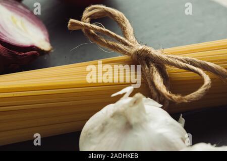 Natural string rope on Italian uncooked pasta Stock Photo