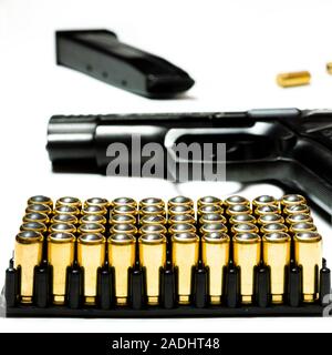 Patrons for a traumatic pistol stand in a black plastic form for cartridges. Weapons Stock Photo