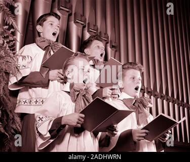 1940s FOUR CHOIRBOYS SINGING TOGETHER HOLDING HYMN BOOKS STANDING IN FRONT OF CHURCH ORGAN PIPES - c2873 HAR001 HARS INSPIRATION CARING MALES ENTERTAINMENT SIBLINGS SPIRITUALITY CONFIDENCE CHORUS B&W SUCCESS PERFORMING ARTS PIPES STRENGTH LOW ANGLE POWERFUL RECREATION HYMN PRIDE SIBLING CONCEPTUAL STYLISH IN FRONT OF CHORAL CHOIRBOYS COOPERATION GROWTH HARMONY HONORABLE JUVENILES PRE-TEEN PRE-TEEN BOY PRECISION TOGETHERNESS VOICES BLACK AND WHITE CAUCASIAN ETHNICITY HAR001 OLD FASHIONED Stock Photo