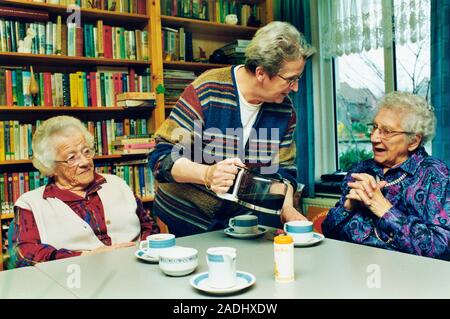 Day centre. Elderly women drinking coffee and talking at a day centre. Photographed in the Netherlands, Stock Photo