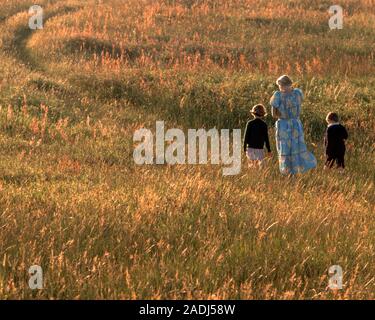 1980s ANONYMOUS SILHOUETTED WOMAN AND TWO CHILDREN BOY AND GIRL WALKING A PATH THROUGH A RURAL MEADOW IN SUMMER EVENING SUNLIGHT - kj8850 PHT001 HARS THROUGH JUVENILE BALANCE FAMILIES JOY LIFESTYLE CELEBRATION FEMALES BROTHERS RURAL HEALTHINESS NATURE COPY SPACE FULL-LENGTH MALES SUNLIGHT WARM SERENITY SIBLINGS SPIRITUALITY SISTERS MEADOW SADNESS SUMMERTIME WIDE ANGLE DREAMS PATH HAPPINESS WELLNESS ADVENTURE LEISURE STRENGTH PASTURE SILHOUETTED AND CHOICE POWERFUL RECREATION DIRECTION A IN SIBLING CONNECTION CONCEPTUAL STYLISH SUNLIT SUPPORT ANONYMOUS PASTORAL HILLSIDE JUVENILES MID-ADULT Stock Photo