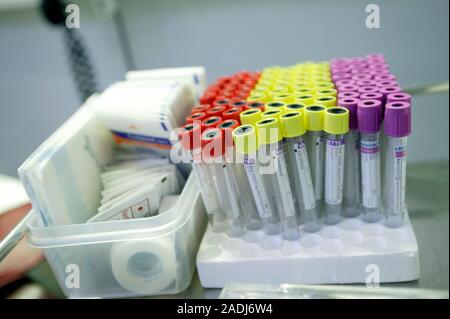 Blood sample tubes. Vacutainers that are used to hold samples of blood collected from patients or blood donors. In the box next to the vacutainers are Stock Photo