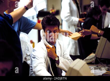 Hospital doctor using a telephone in an accident and emergency department. Stock Photo