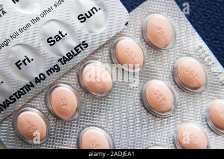 Cholesterol-lowering drug. Blister packs of the cholesterol-lowering drug Simvastatin. This drug reduces the levels of low-density lipoprotein (LDL) c Stock Photo