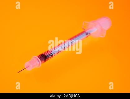 Insulin syringe. Hypodermic syringe used by diabetics. This disposable syringe is for use with U-100 strength insulin. Stock Photo