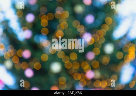 Defocused background of christmas tree and christmas lights and decorations Stock Photo