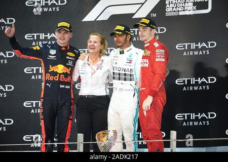 The podium (L to R): second placed Charles Leclerc (MON) Ferrari