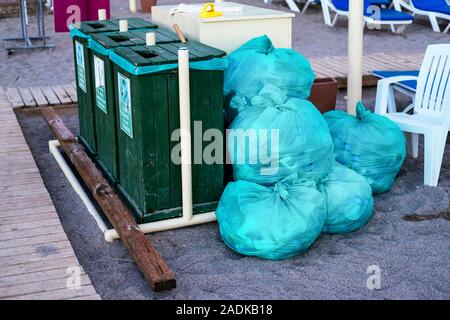 Garbage bags on beach. Waste recycling. Environmental pollution. Environment plastic pollution. Trash and waste bin. Stock photography. Stock Photo