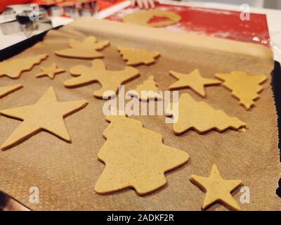 Close up of childs hands making christmas ginger cookies Stock Photo