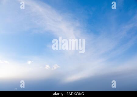 white wispy clouds in the sky Stock Photo