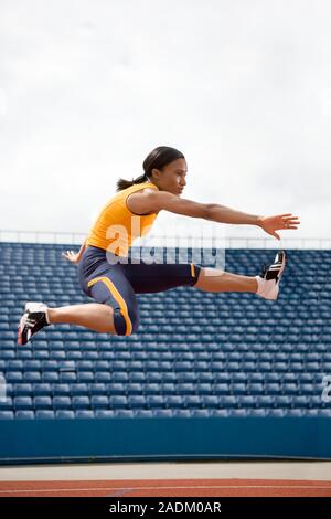MODEL RELEASED. Airborne hurdler. Stock Photo