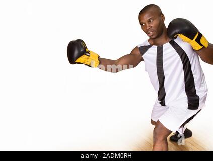 MODEL RELEASED. Boxer punching. Composite high- speed photograph of a boxer shadow boxing. This is a training technique in which the boxer fights an i Stock Photo