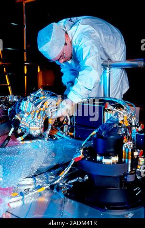Mars Express spacecraft construction. Engineer checking the position of cables in the Mars Express spacecraft during its construction in the clean roo Stock Photo