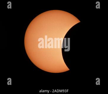 Partial phase of the annular eclipse which occurred on May 10th 1994. The image was taken at 16:10 Universal Time (UT) when the Moon was occulting 27% Stock Photo
