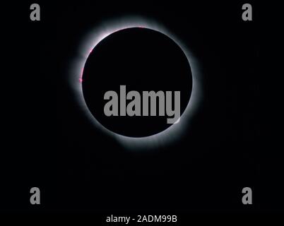 Total solar eclipse. Inner corona of the Sun, seen during a total solar eclipse. The corona is a cloud of low-density plasma (hot ions) surrounding th Stock Photo
