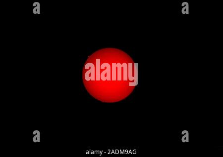 Annular solar eclipse. Image 14 of 14. Full Sun seen after an annular solar eclipse. The Moon (not seen) has finished moving across the Sun. This proc Stock Photo