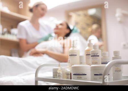 Selective focus of facial creams on the shelf in beauty salon Stock Photo