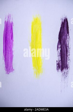 Three colourful vertical paint stripes on a white background Stock Photo