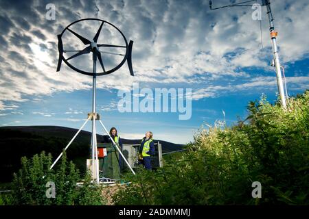 MODEL RELEASED. Rooftop wind energy system under development. The use of these turbines is known as microgeneration. They generate carbon-free or low- Stock Photo