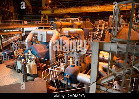 Power station turbine hall. High and intermediate pressure turbines in a coal-fired power station. Steam, produced by the heat from burning coal, is p Stock Photo