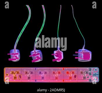 Electrical plugs and socket extension. Coloured X- ray of four 3-pin electrical plugs and a socket extension board. The plugs connect domestic applian Stock Photo